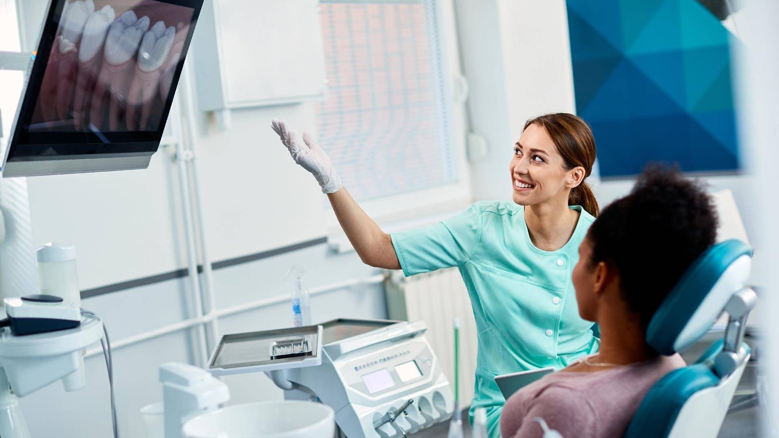 North Miami dentist reviewing a panoramic X-ray with a patient
